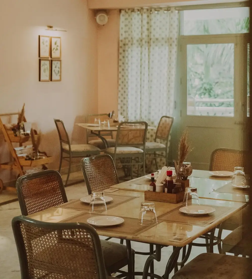 Cane chairs by the window at Café Auberge, Jaipur